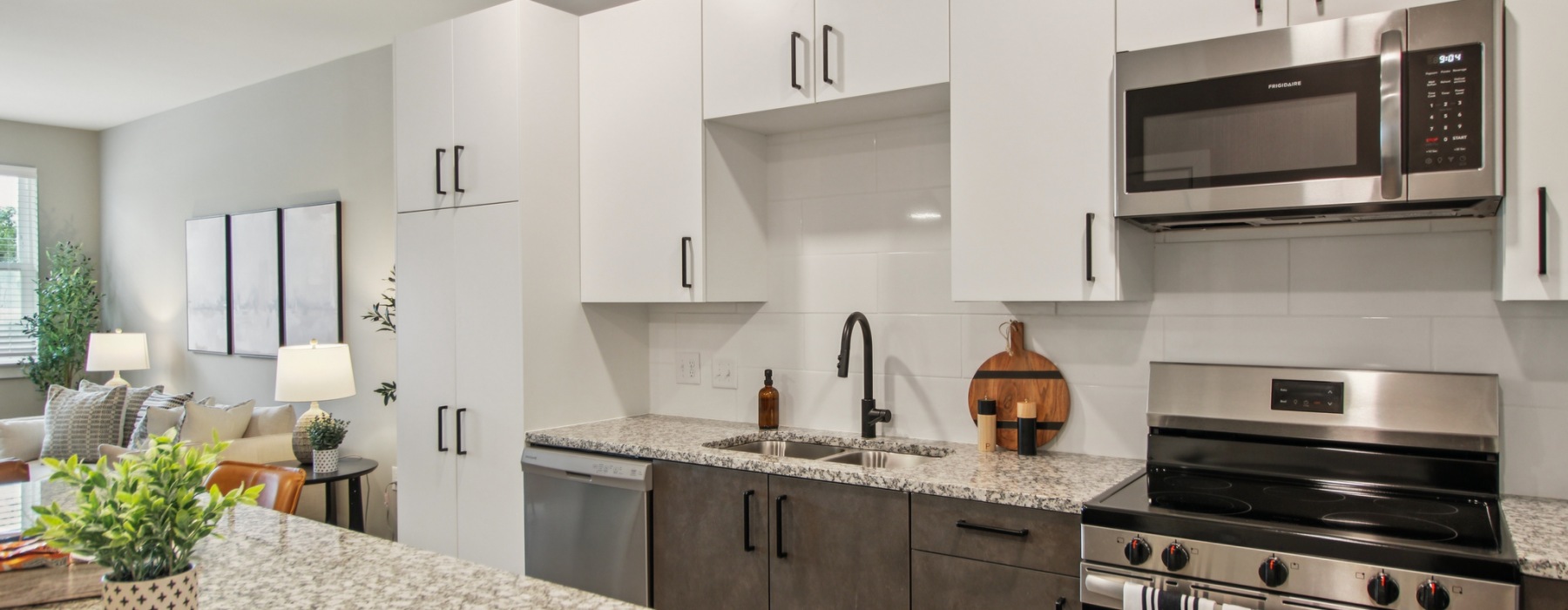a kitchen with white cabinets